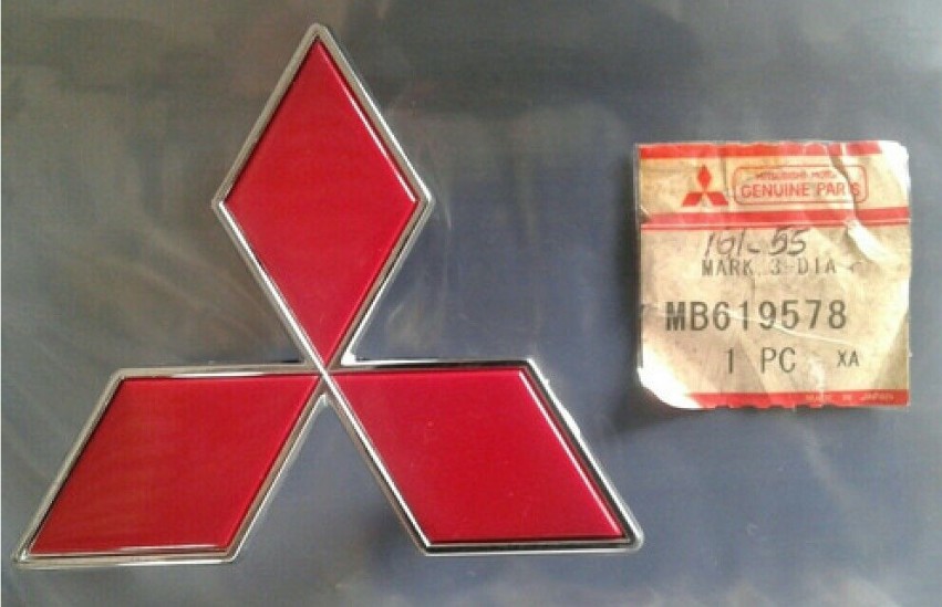 MB619578 EMBLEMA LOGO MITSUBISHI ANTERIORE ORIGINALE NUOVO